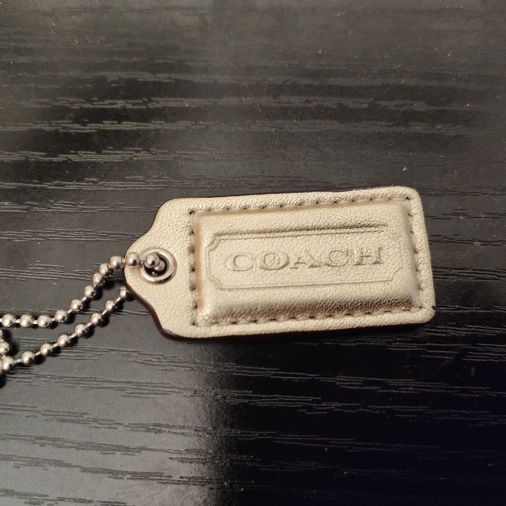 Coach Gold hang tag..